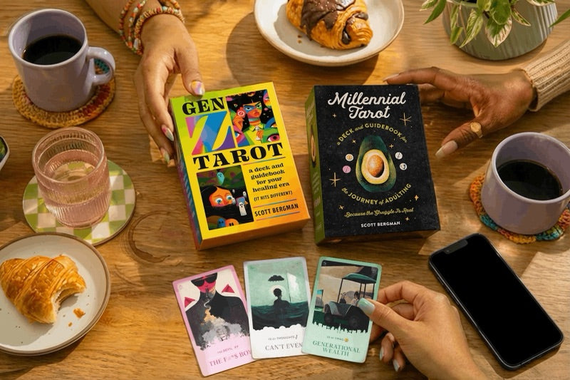Both decks on a wooden table mid-reading